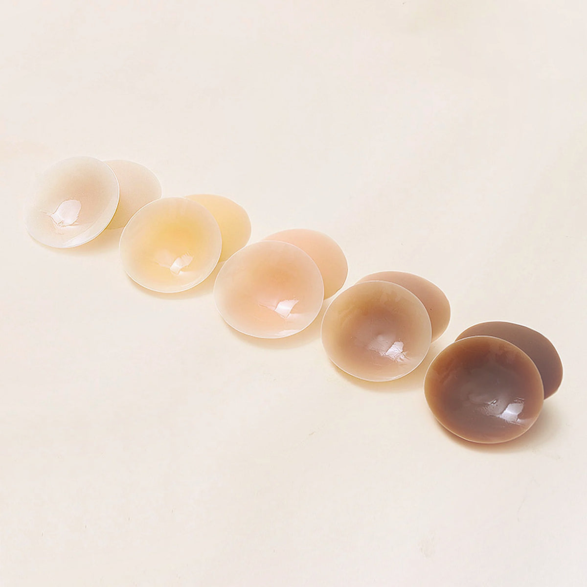 Le Nu — cache-tétons ronds en silicone réutilisable, les cinq teintes Sensora Paris